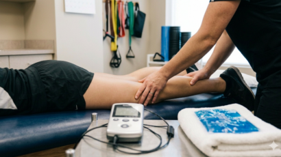 Physical therapist doing sports rehab on patient